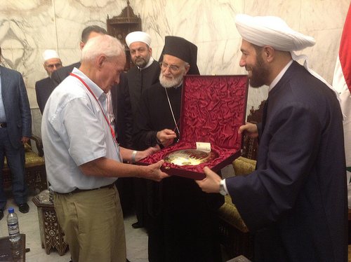 Bill Stanley receives a gift from Dr Hassoun (the Grand Mufti of Syria)