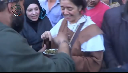 Eating together olives (the unique vegetable available in the besieged city) as a sign of peace